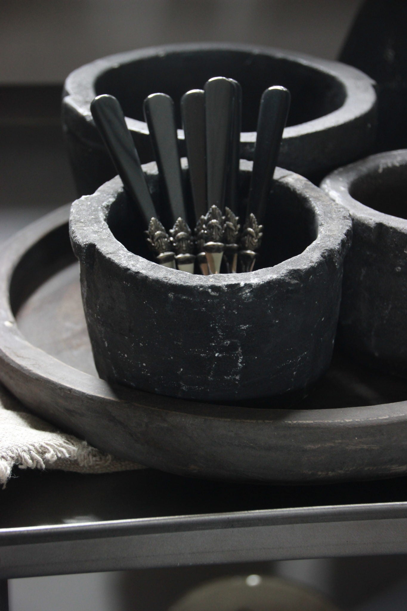 Theelepel met zwart handvat