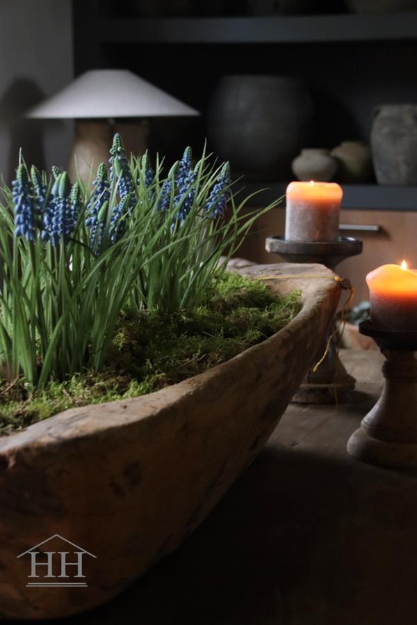 Artificial blue grape hyacinths in a black inner pot