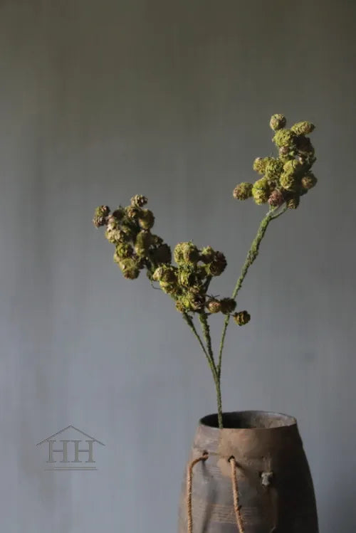 Artificial branch with pine cones