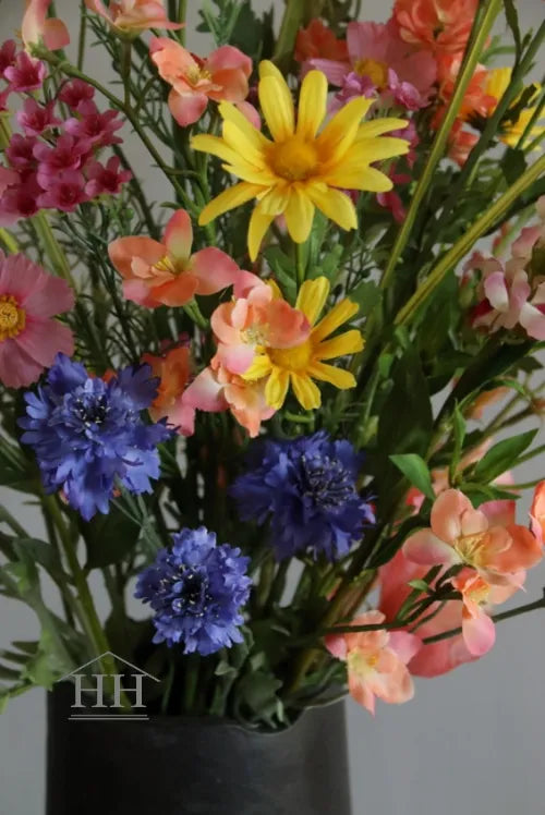 Kunstbloemen boeket in geel, oranje, blauw en zalm