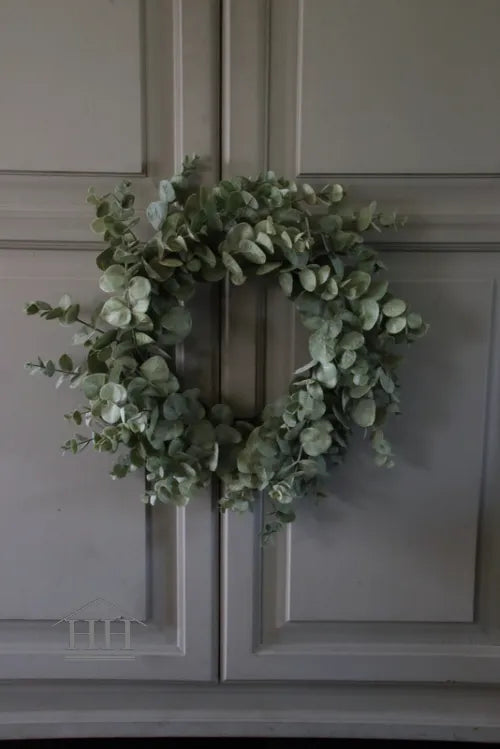 Wreath of artificial branches and artificial moss