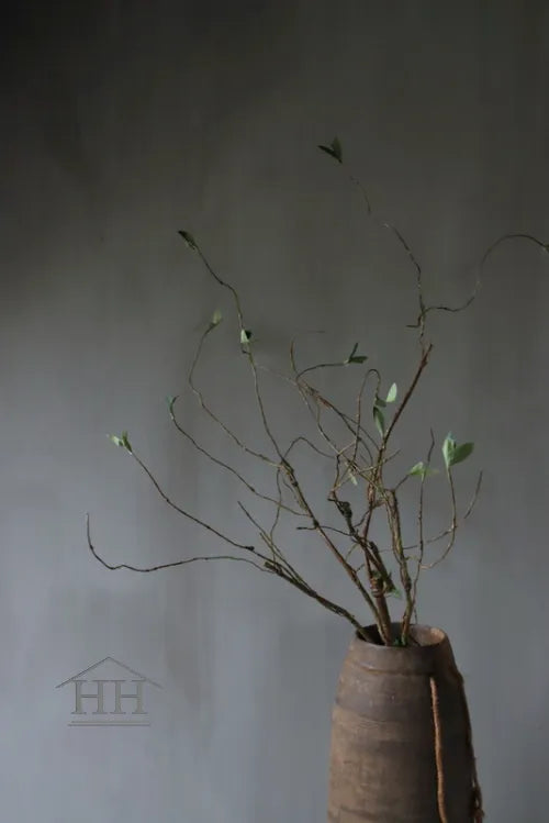 Artificial branch with green leaves 