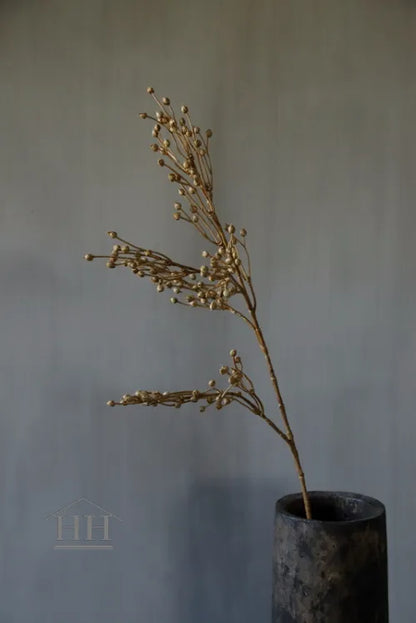 Lijnzaadbolletjes kunsttak goud geel - 66cm