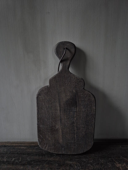 Vergrijsd bruin koffieplankje te gebruiken als onderzetter of om een kopje koffie op te serveren